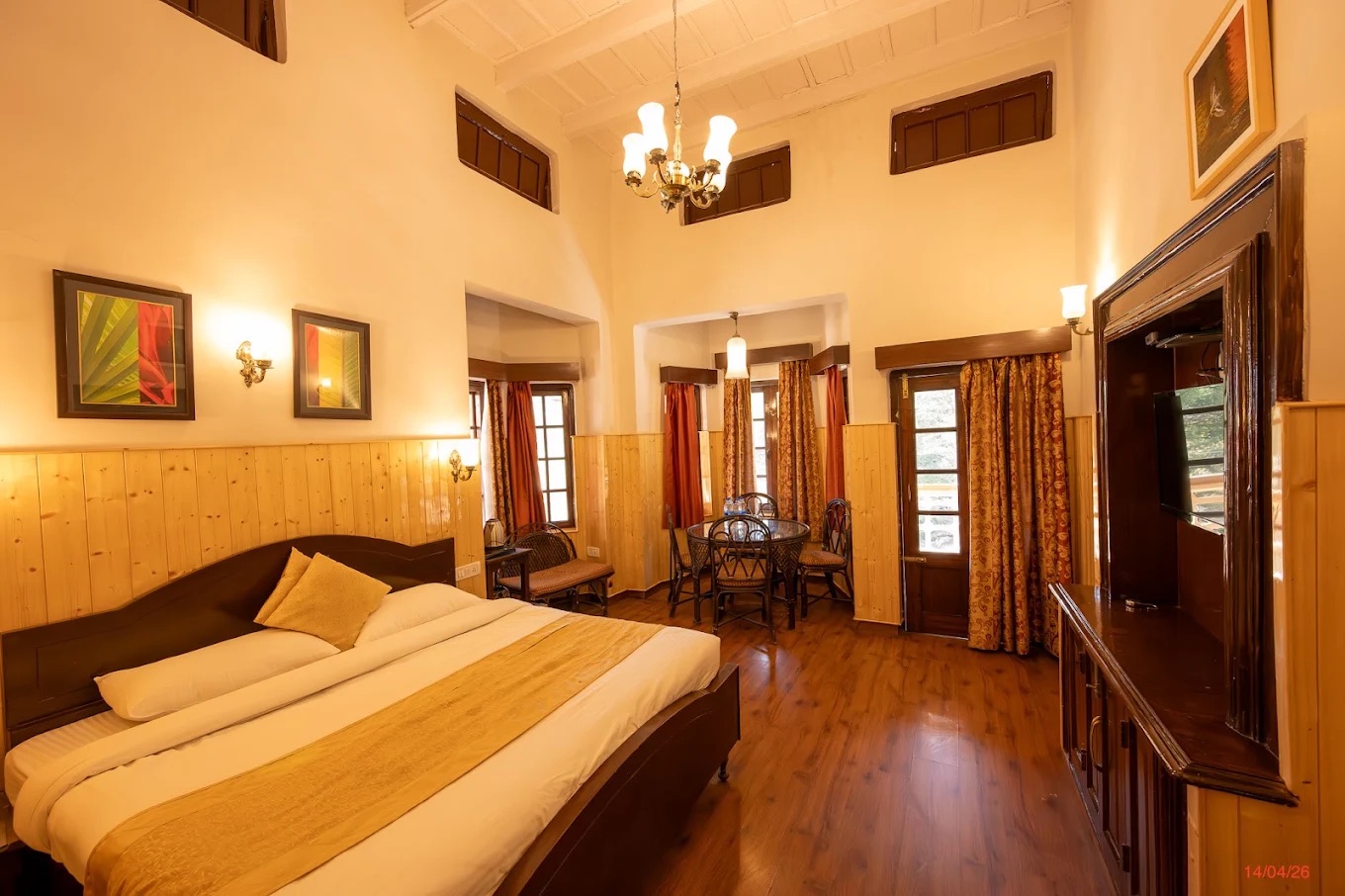 A warm heritage hotel room with wooden panelling