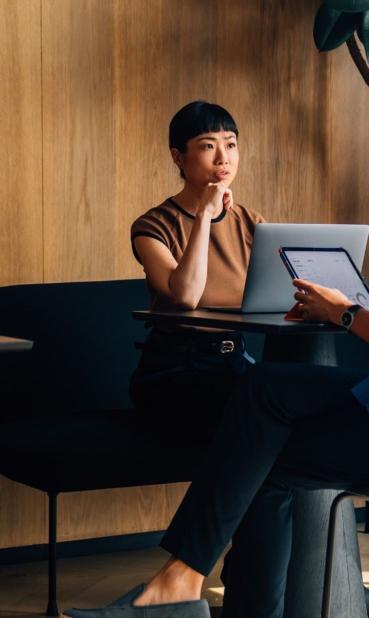Two colleagues working together at a table